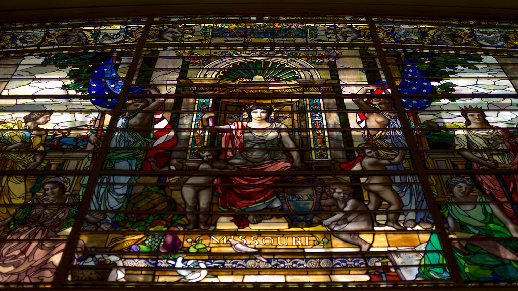 Sunlight pierces a stained glass window in the Capitol building